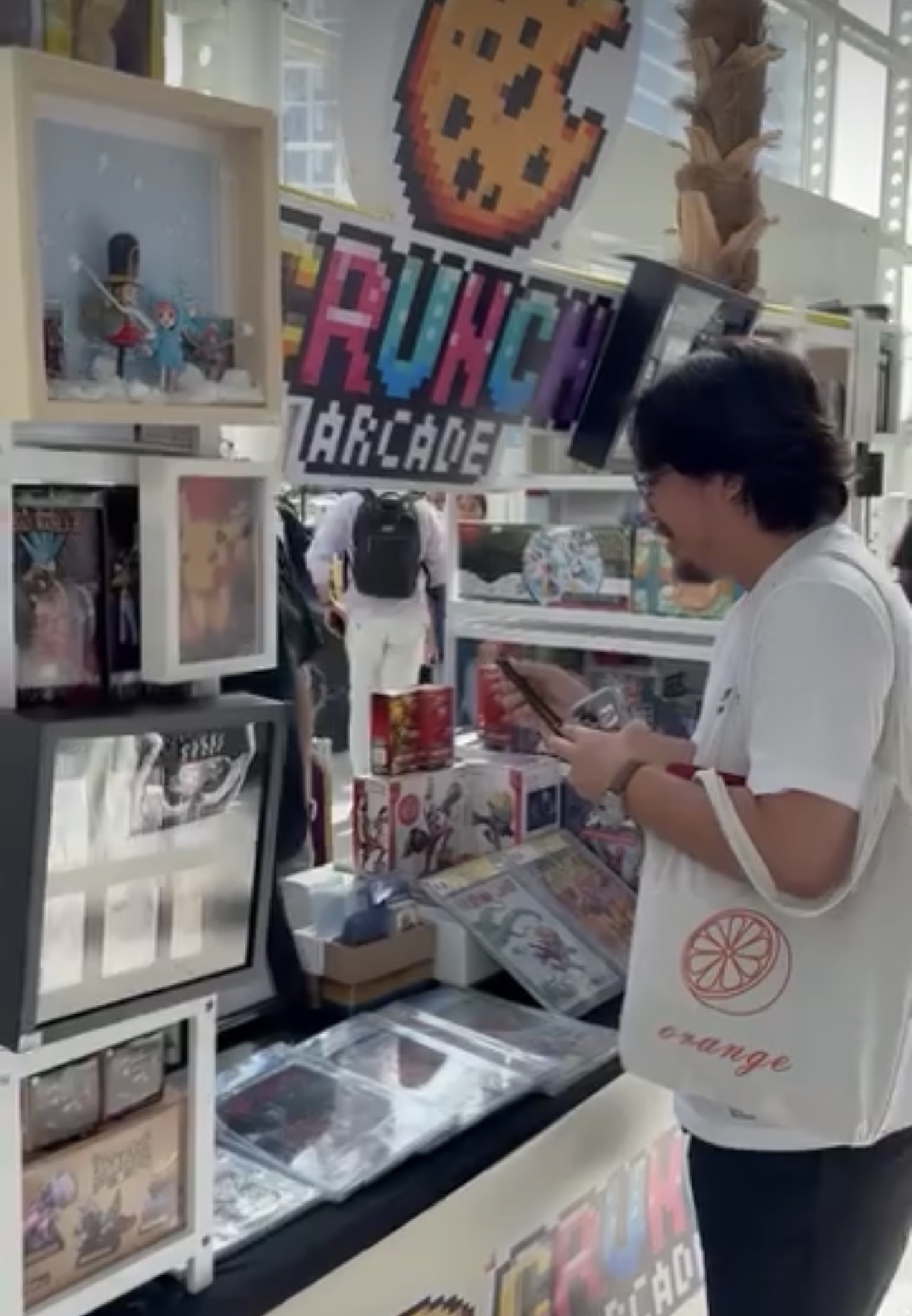Customer browsing the Crunch Arcade retail display